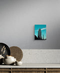 City building photo canvas print by Petals & Ash Studio featuring a vibrant urban skyline on a decorative wall art piece.
