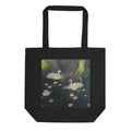 Black Swan Lake Tote Bag T-shirt by Petals & Ash Studio featuring a stylish tote bag with a Swan Lake design on the front.