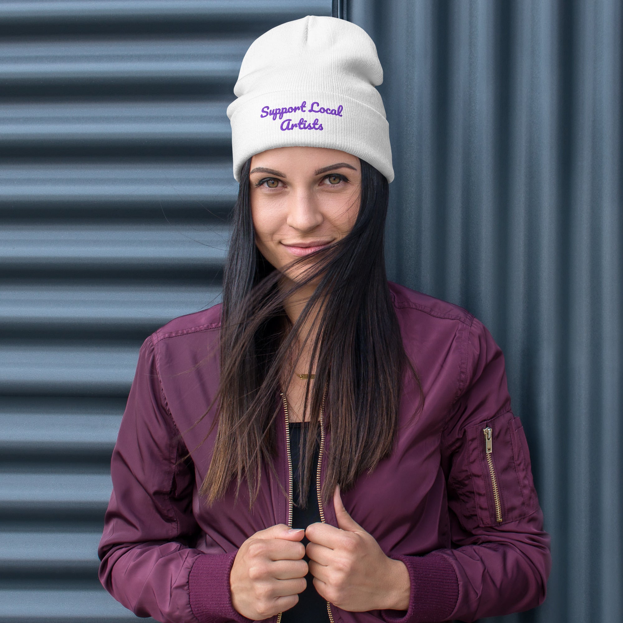 White knitted beanie with embroidered "Support Local Artists" design by Petals & Ash Studio, front view.