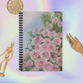 Pink roses design ruled line spiral notebook by Petals & Ash Studio, featuring a floral cover and lined pages for writing.