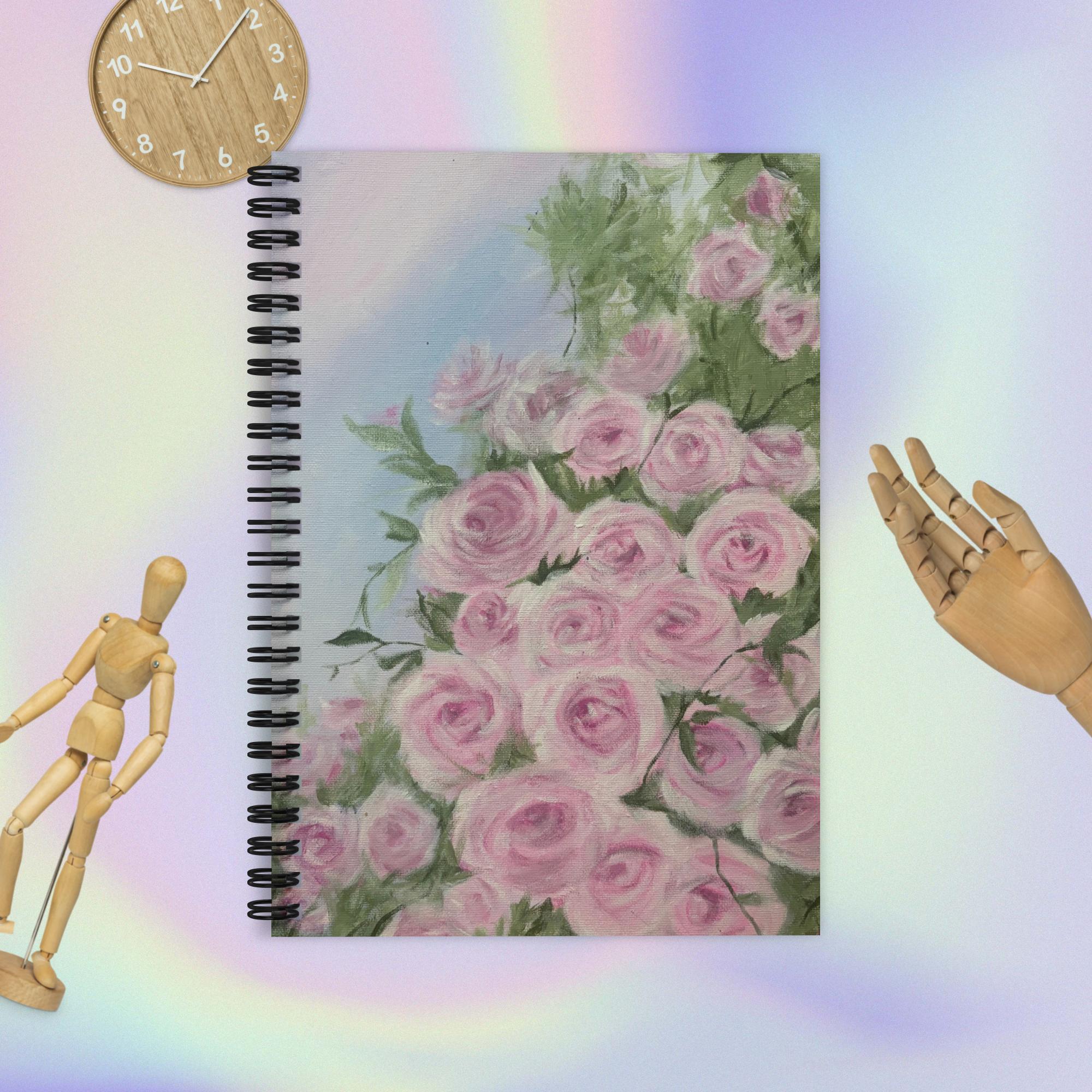 Pink roses design ruled line spiral notebook by Petals & Ash Studio, featuring a floral cover and lined pages for writing.