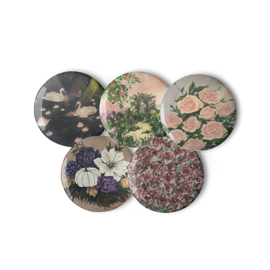Set of Petals & Ash Studio artwork pin buttons featuring white backgrounds and colorful designs, 2.25 inches in size.