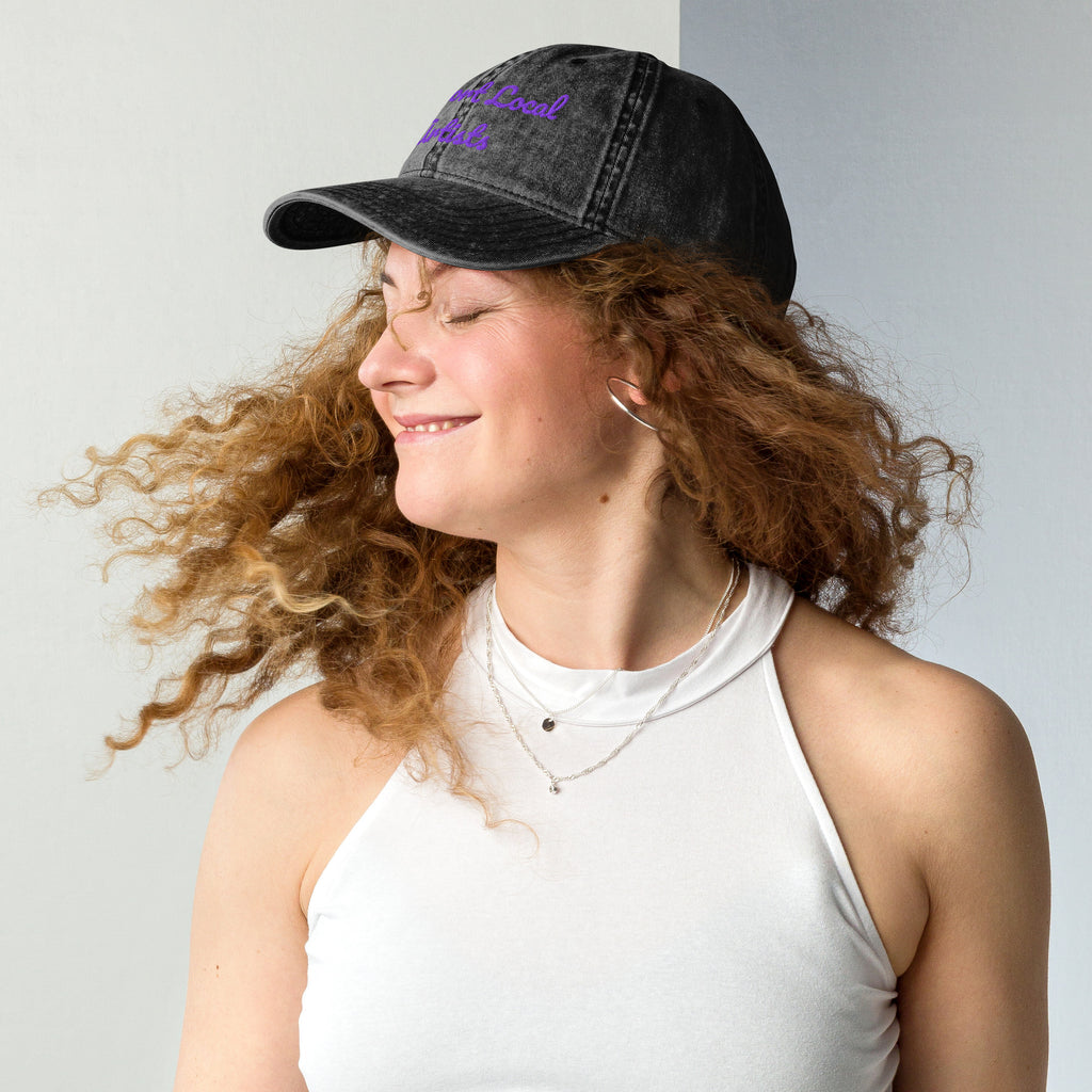 Black vintage cotton twill cap with "Support Local Artists" embroidered design, by Petals & Ash Studio, shown from the left side.